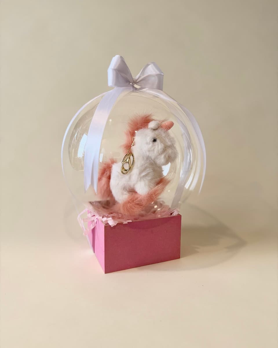 Unicornio llavero peluche en globo burbuja